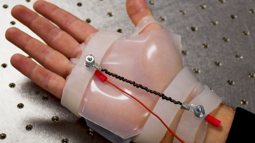 Photo of hand wearing robotic rehabilitation device